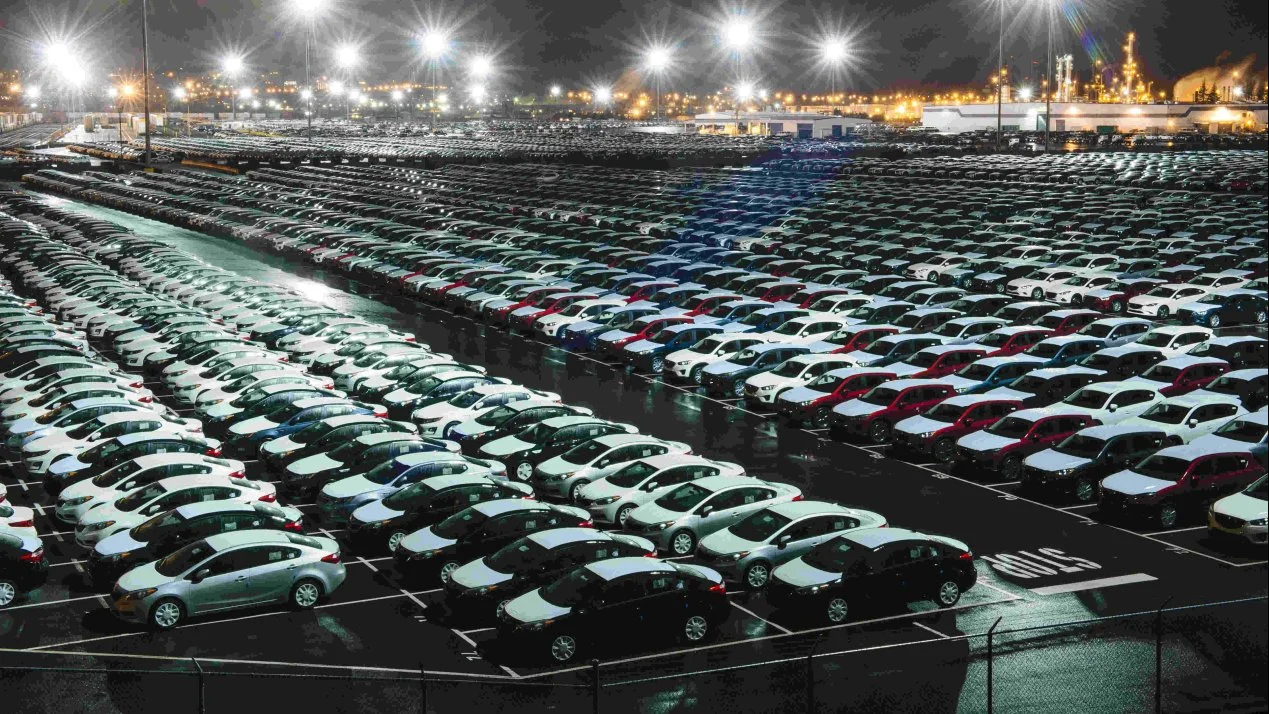 Port congestion with thousands of vehicles aligned in bays